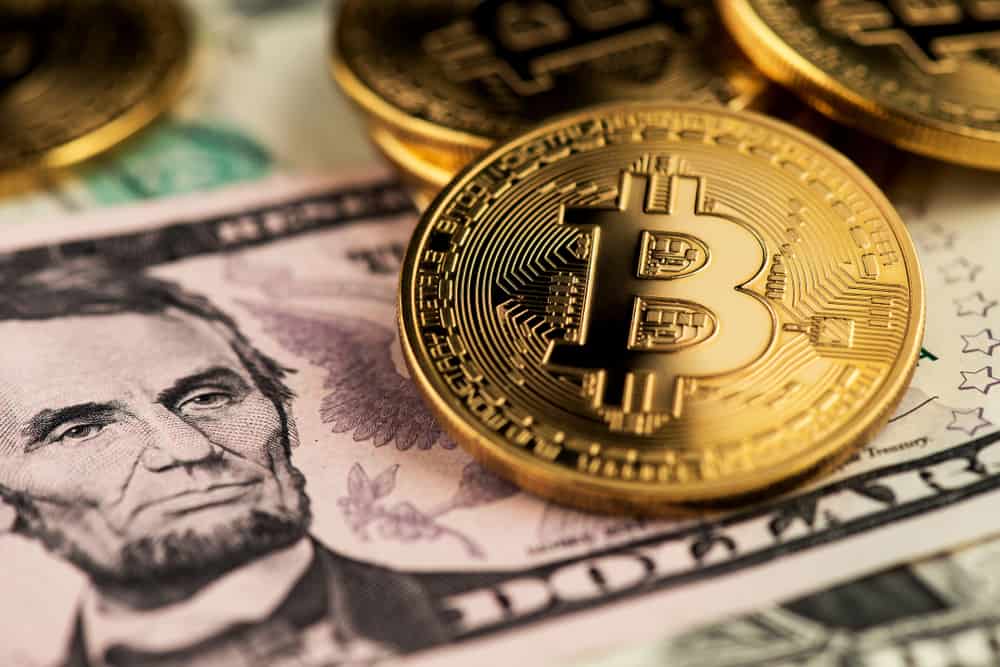 Bitcoin Coin on a USA Dollar